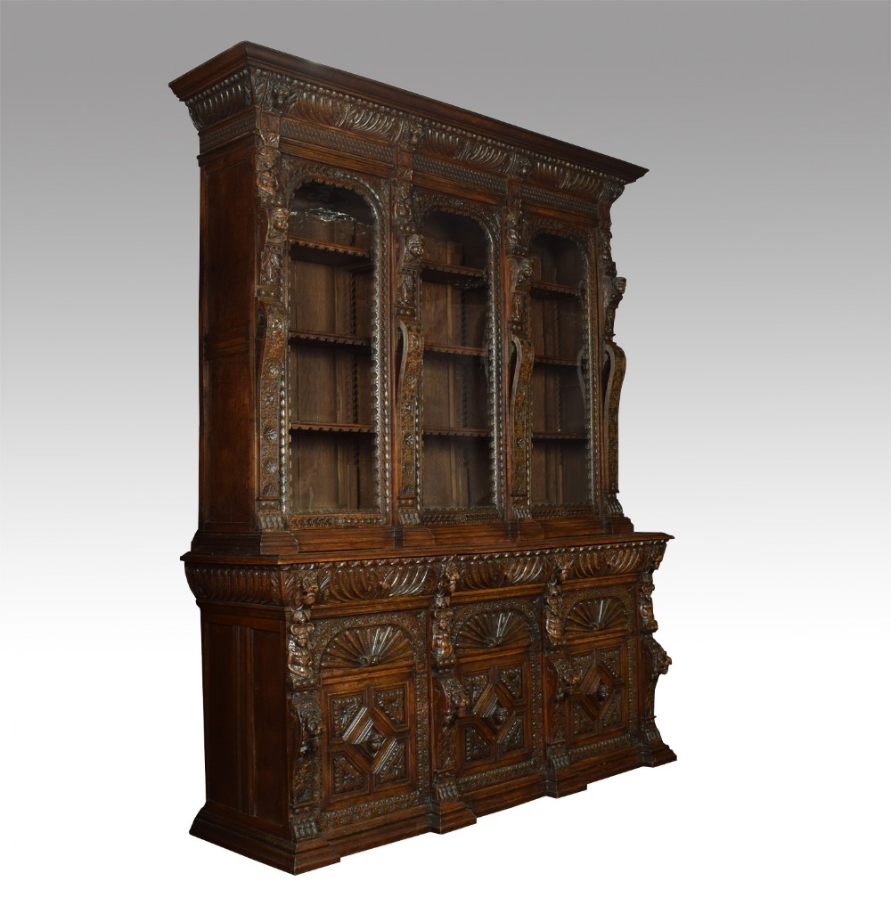 Large carved oak three door bookcase