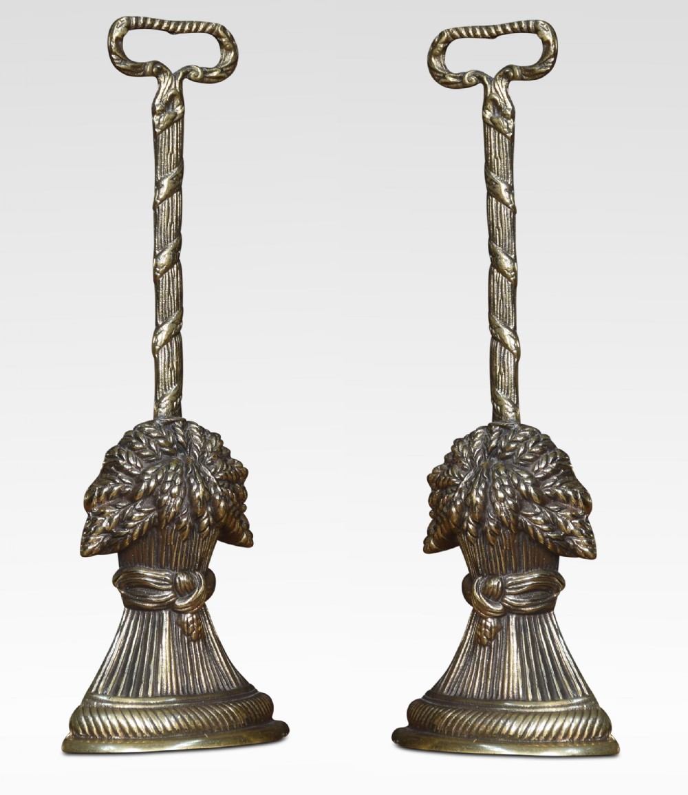 Pair of brass door stops