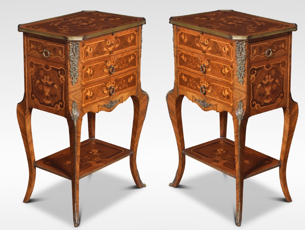 Pair of marquetry inlaid and gilt metal mounted bedside chests