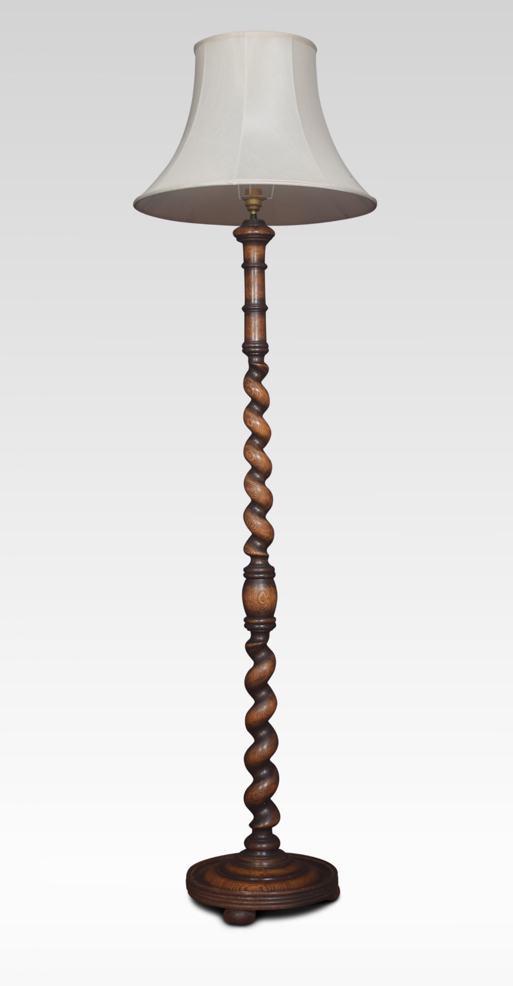 Carved oak standard lamp