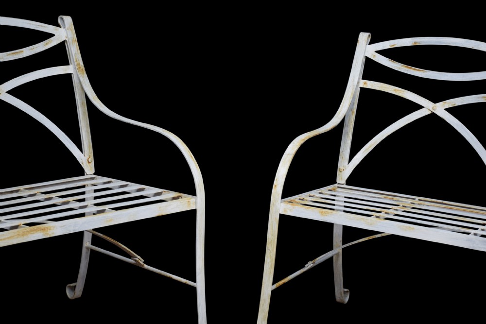 Pair of regency style white painted metal garden benches View II