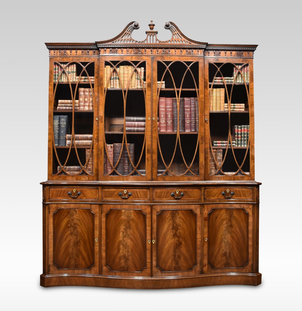 George III style mahogany serpentine fronted bookcase