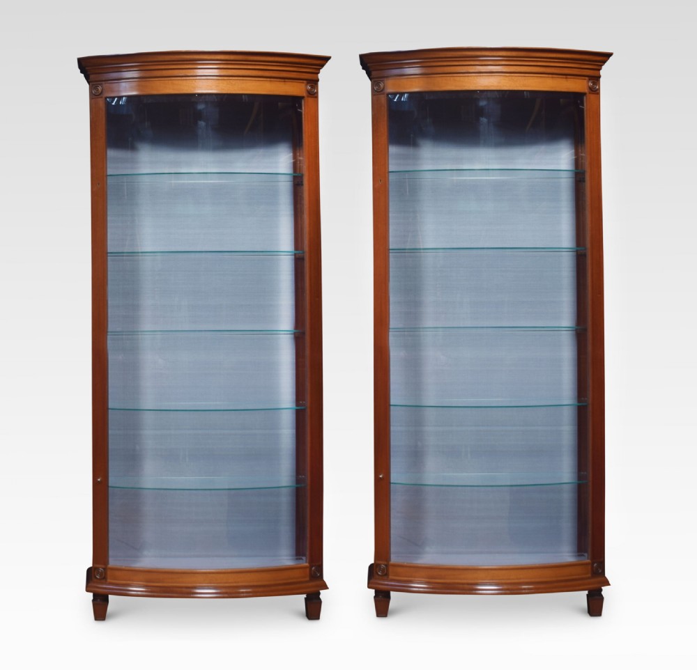 Pair of mahogany bow fronted display cabinets