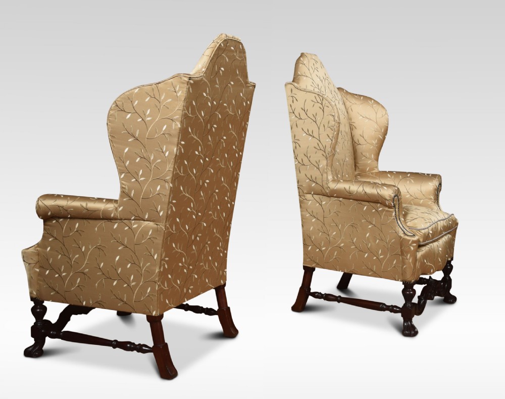 Pair of high back wing armchairs