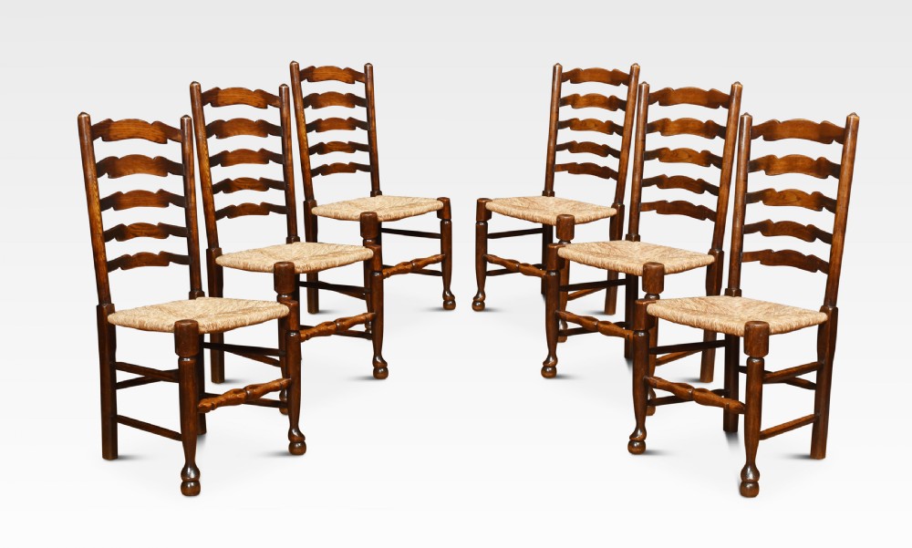 Set of six oak ladder back dining chairs