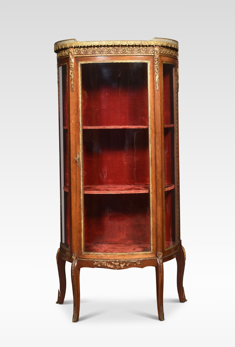 Walnut bow fronted display cabinet