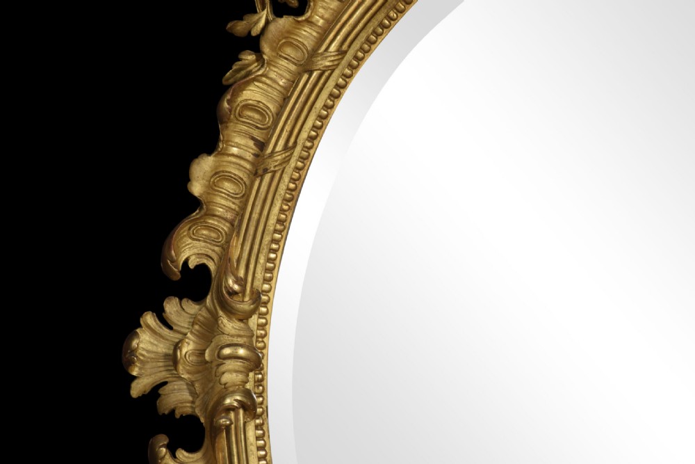 Rococo revival giltwood oval wall mirror View V
