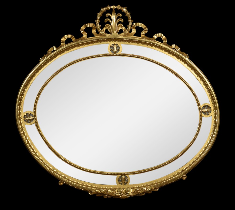 Gilt oval wall mirror