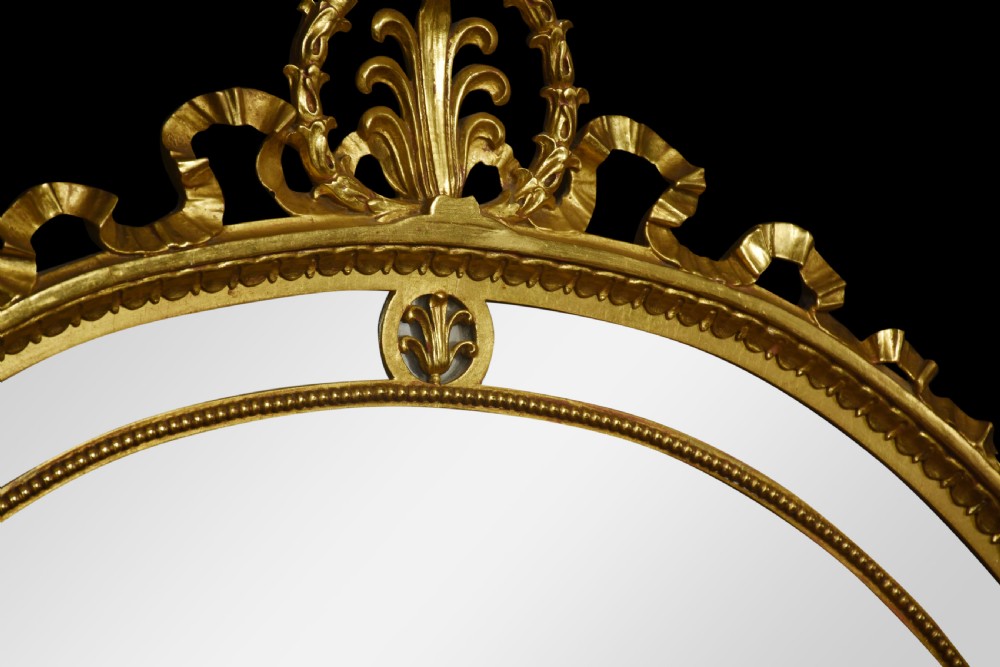 Gilt oval wall mirror View III