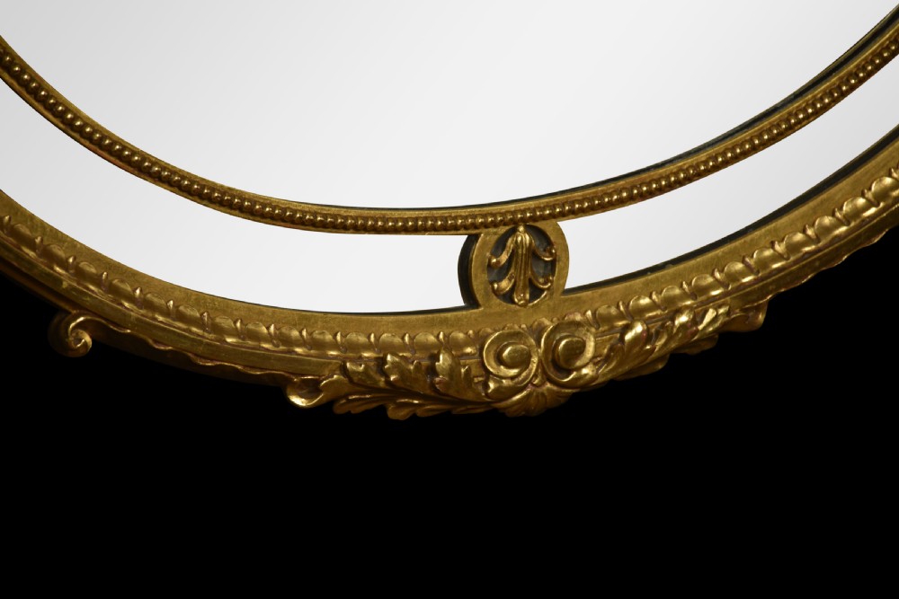 Gilt oval wall mirror View V