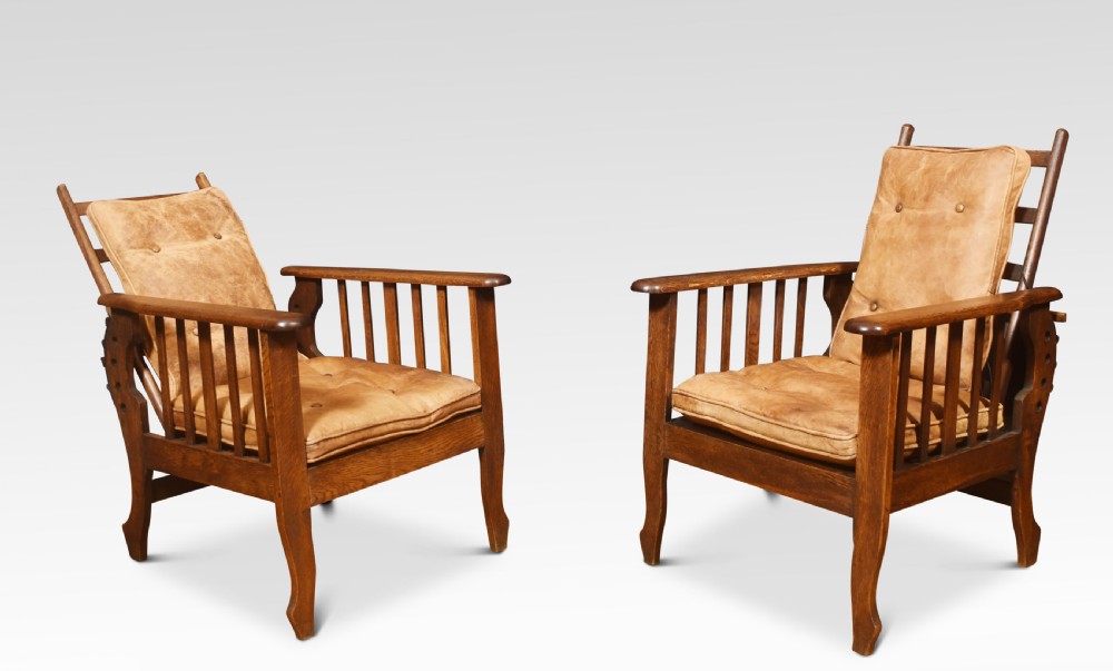 Pair of oak reclining armchairs