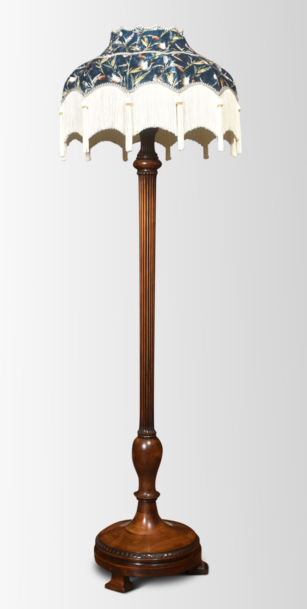 Carved walnut standard lamp