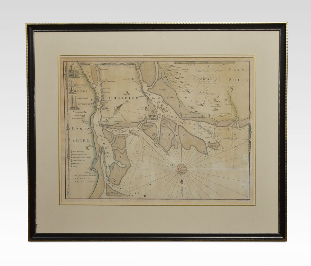 A framed 18th-century nautical chart depicting Liverpool Harbour and surrounding coastlines, mounted with a cream mat in a dark frame.