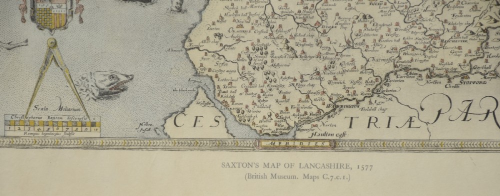 A framed antique map of Lancashire featuring hand-coloured detail, ornate cartouches, and a dark wooden frame with gold inner trim. View III