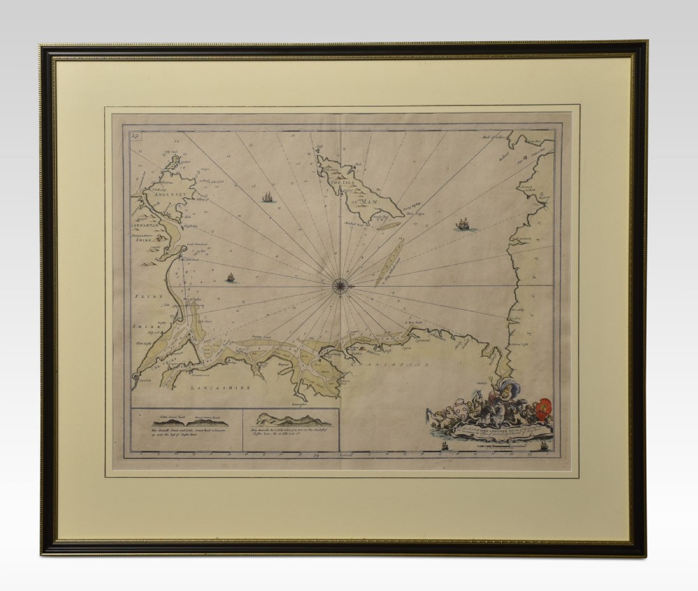 A framed antique hand-tinted sea chart depicting the Northwest Coast of England and the Isle of Man, set in a dark wood frame with a cream mount.