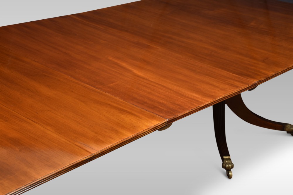 Regency mahogany triple pillar dining table View VII
