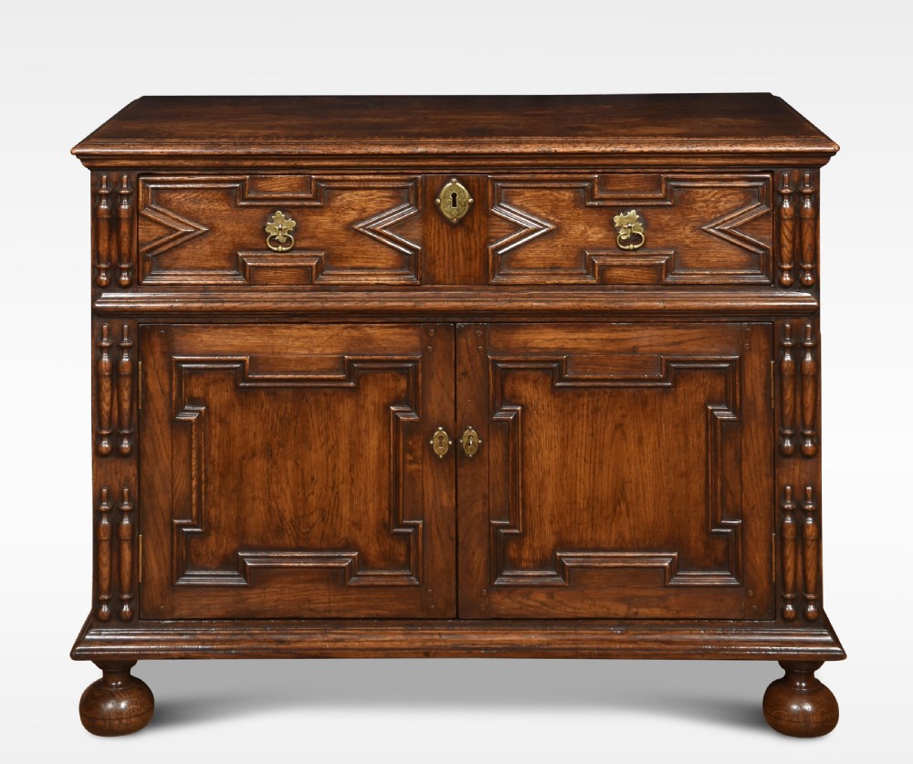Jacobean style carved oak cabinet