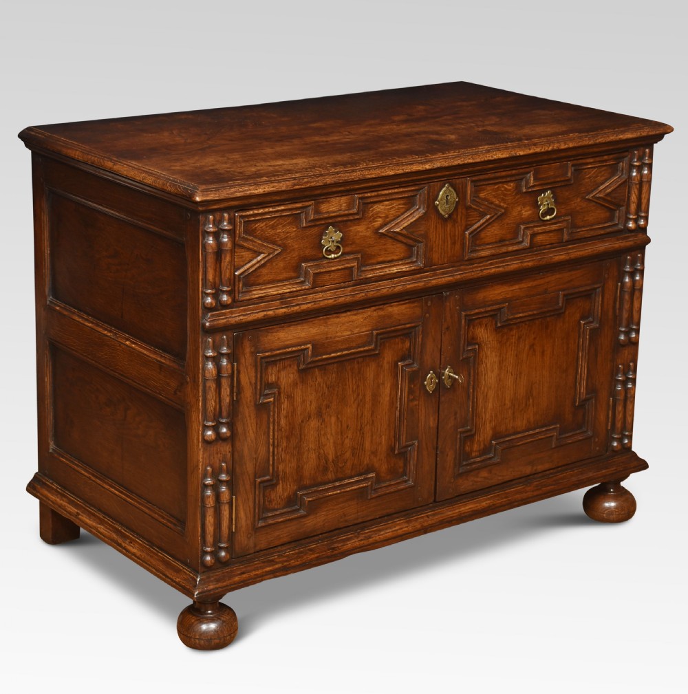 Jacobean style carved oak cabinet View II