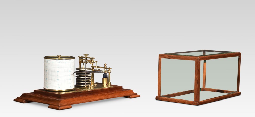 An antique walnut cased barograph featuring bevelled glass panels, a brass clockwork recording drum, and an aneroid mechanism set on a moulded wooden base. View II