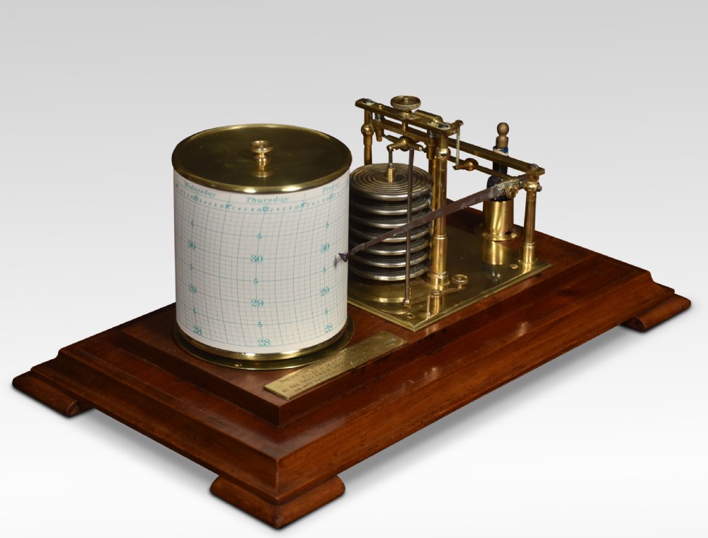 An antique walnut cased barograph featuring bevelled glass panels, a brass clockwork recording drum, and an aneroid mechanism set on a moulded wooden base. View IV
