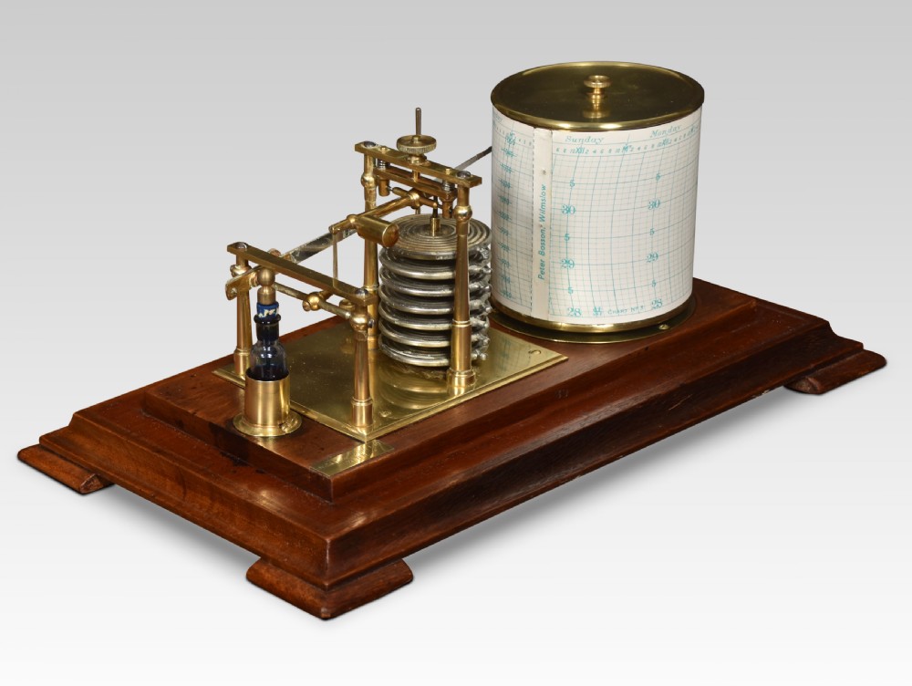 An antique walnut cased barograph featuring bevelled glass panels, a brass clockwork recording drum, and an aneroid mechanism set on a moulded wooden base. View VIII