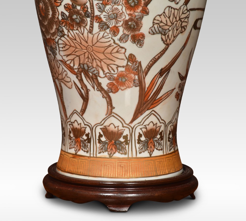 A Japanese Satsuma earthenware vase mounted as a table lamp base, decorated with hand-painted floral motifs in gold and terracotta enamels on a wooden stand. View III