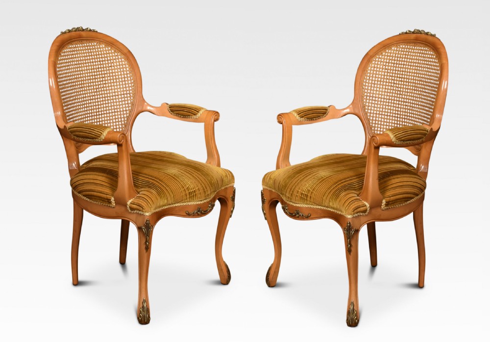 Set of eight cane dining chairs View II