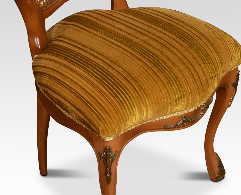 Set of eight cane dining chairs View IV