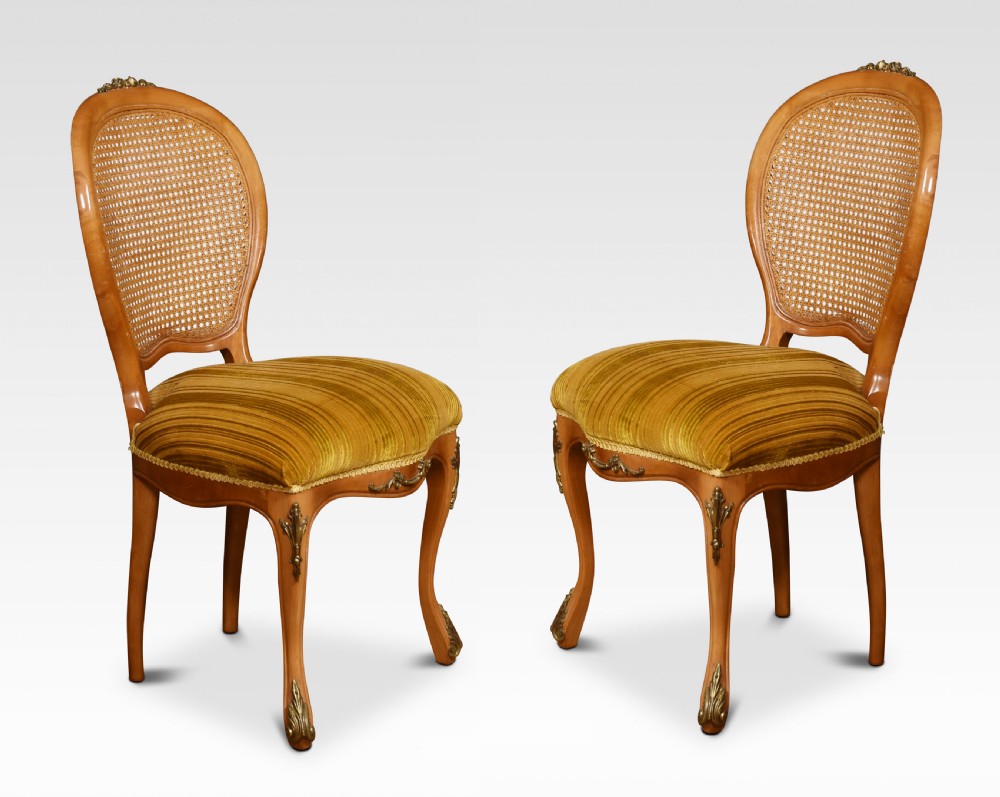 Set of eight cane dining chairs View VI