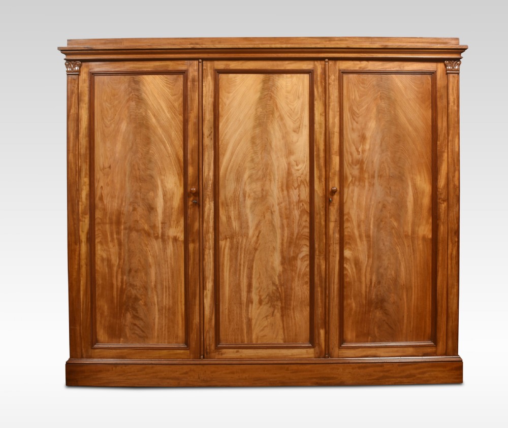 Mahogany three door wardrobe