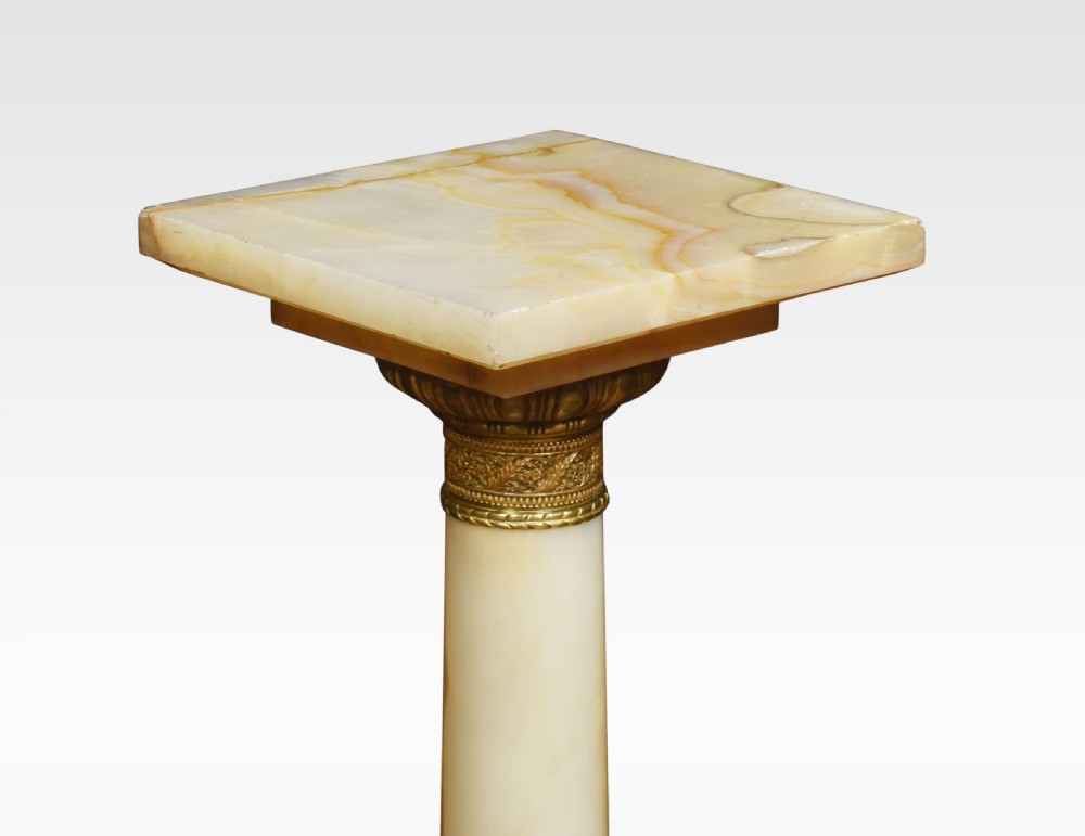A tall cream onyx column pedestal with a square top, gilt bronze mounts, and decorative feet. View III