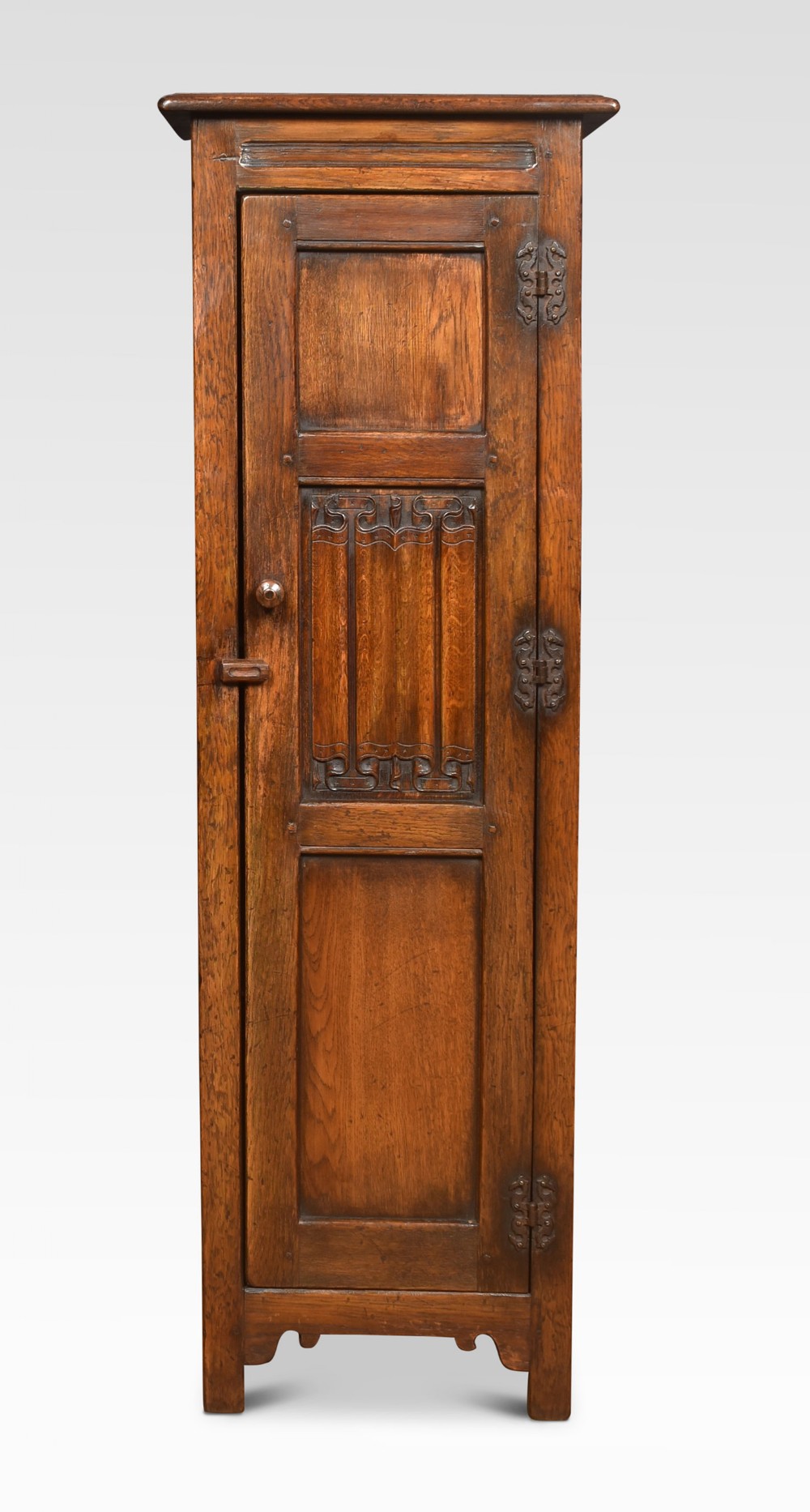 Carved oak hall cupboard of small proportions