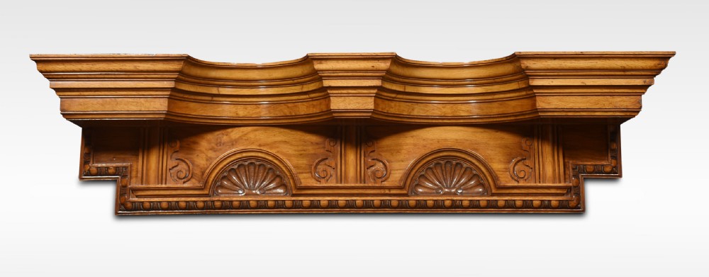 A carved pollard oak overdoor pediment featuring double carved shell motifs, stepped breakfront mouldings, and rich natural wood graining. View II