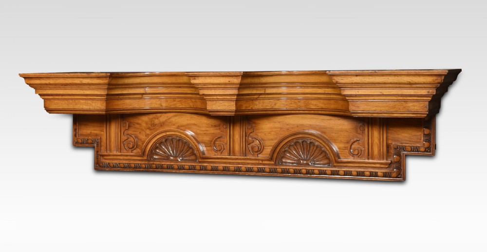 A carved pollard oak overdoor pediment featuring double carved shell motifs, stepped breakfront mouldings, and rich natural wood graining. View IV