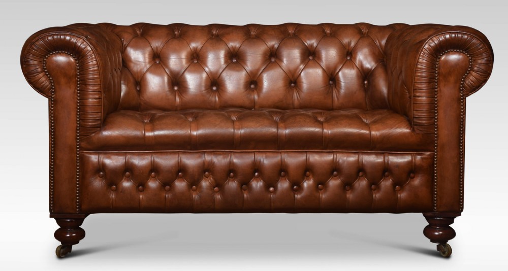 Brown leather chesterfield