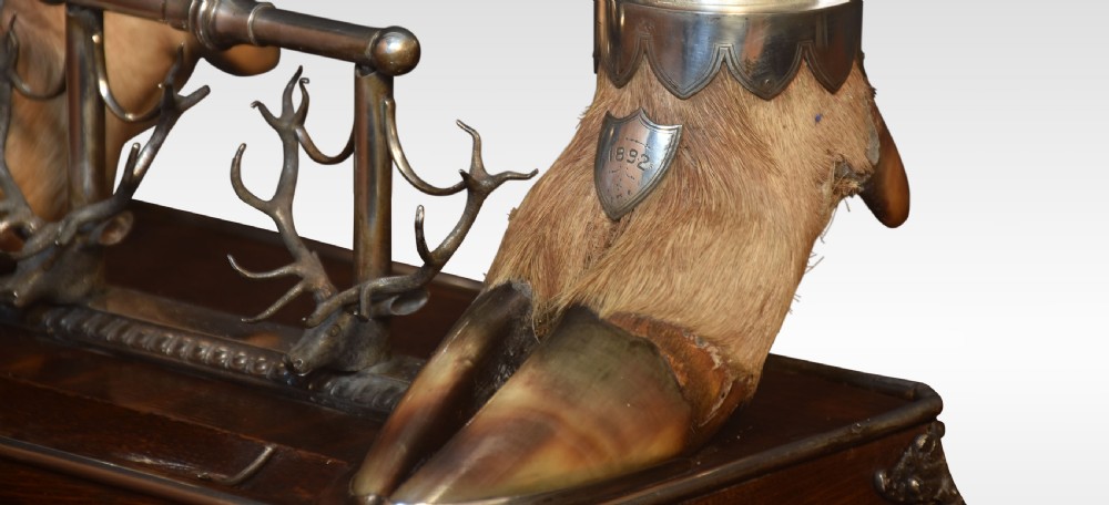 A 19th-century Scottish double inkwell set featuring two silver-capped deer hooves and stag head pen rests mounted on a mahogany base. View III