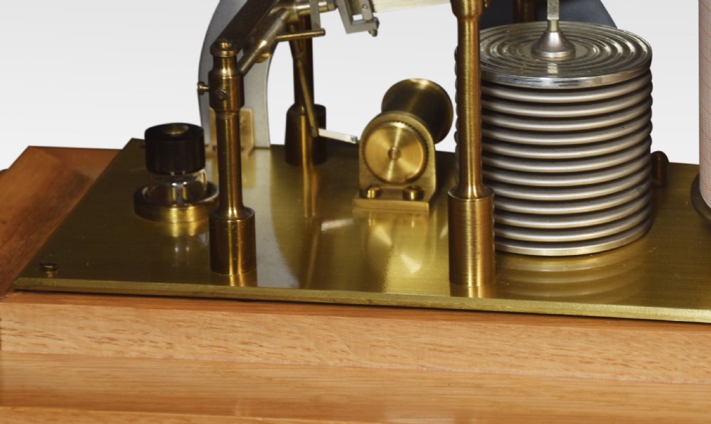 An antique oak and glass cased barograph by Negretti and Zambra featuring an internal clockwork drum, aneroid capsule stack, curved silvered scale, and base drawer. View VI