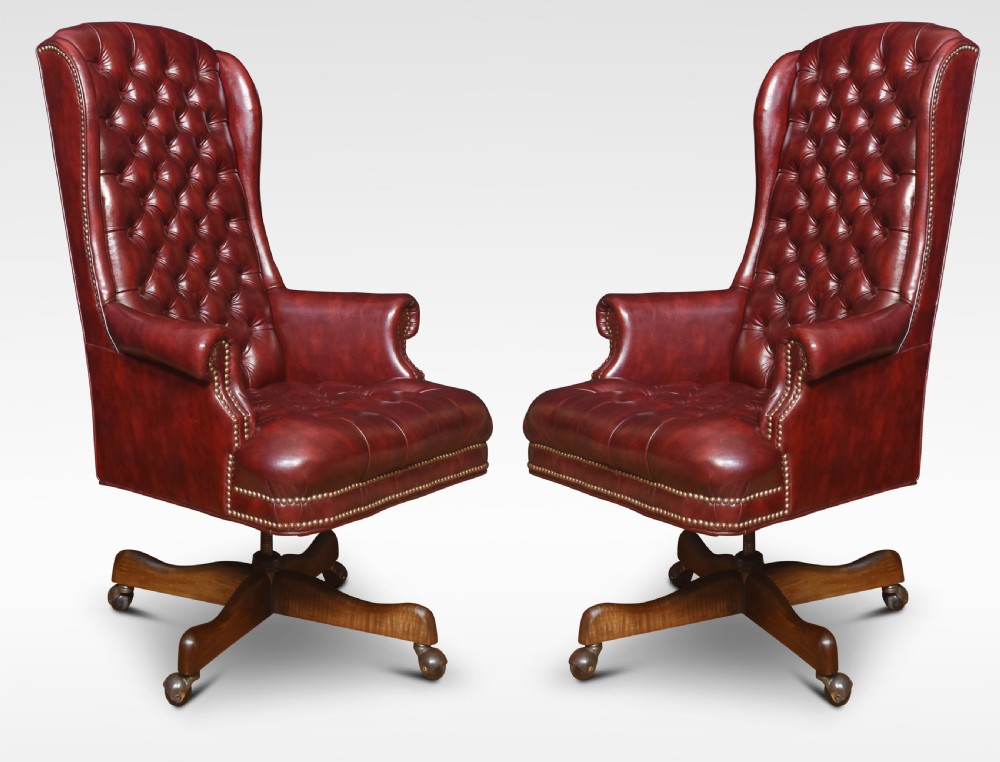 Pair of swivel office chairs