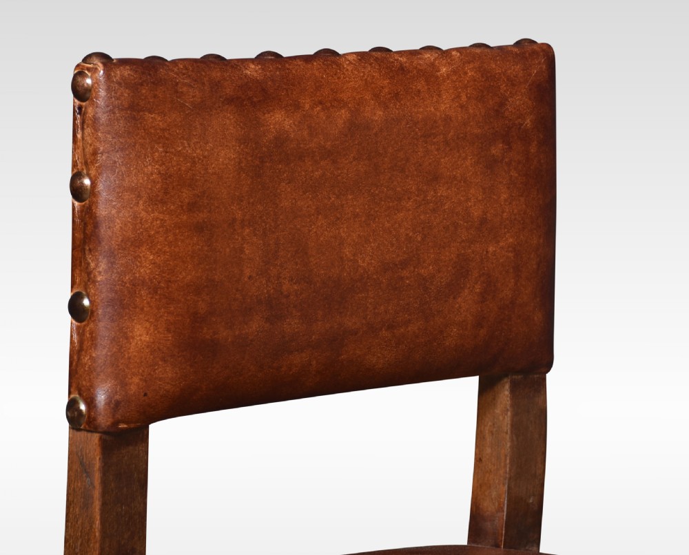 Set of ten substantial oak dining chairs View VI