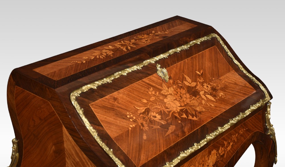An antique French rosewood bureau de dame featuring floral marquetry inlays, gilt-bronze mounts, a sloped writing fall, and slender cabriole legs. View VI