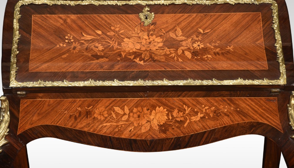 An antique French rosewood bureau de dame featuring floral marquetry inlays, gilt-bronze mounts, a sloped writing fall, and slender cabriole legs. View VII