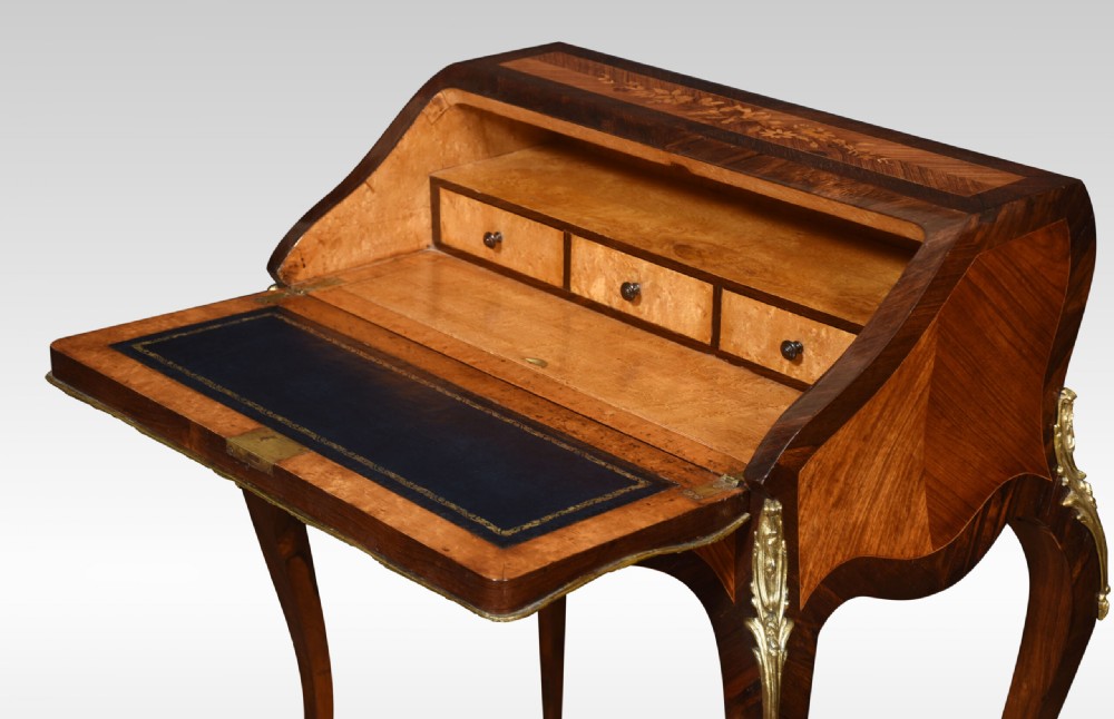 An antique French rosewood bureau de dame featuring floral marquetry inlays, gilt-bronze mounts, a sloped writing fall, and slender cabriole legs. View IX