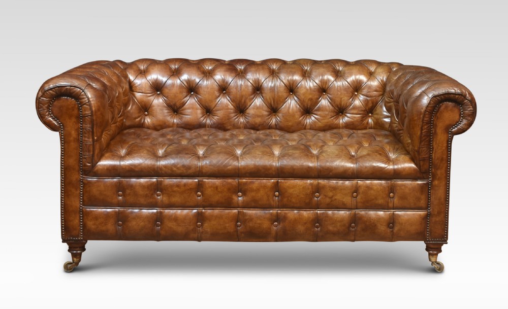 Brown leather chesterfield