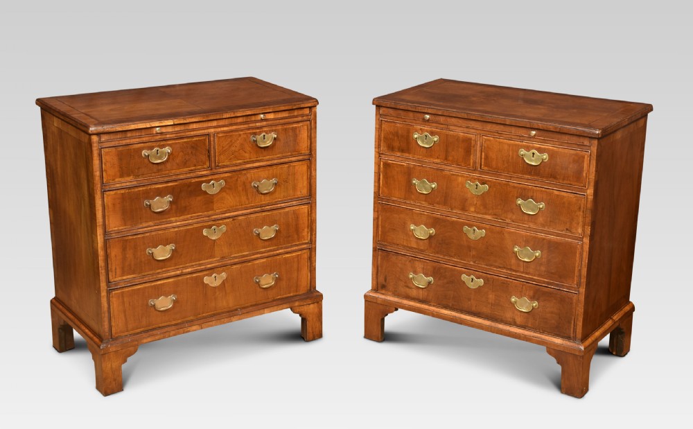 Pair of bachelor’s figured walnut and feather banded chests