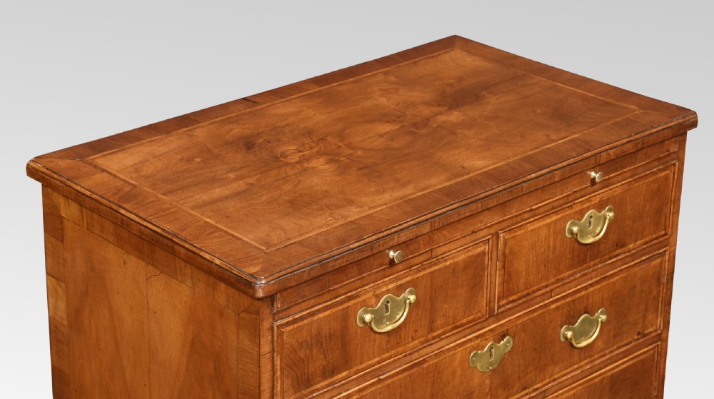 Pair of bachelor’s figured walnut and feather banded chests View III