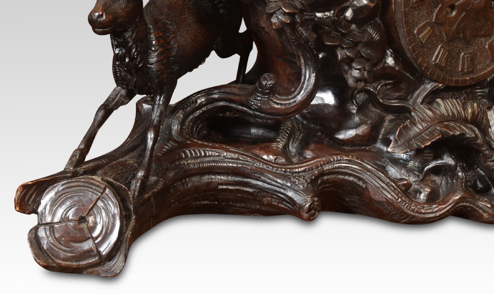 A nineteenth-century Black Forest carved wood mantel clock garniture set featuring sculpted alpine chamois figures atop rocky outcrops. View VIII