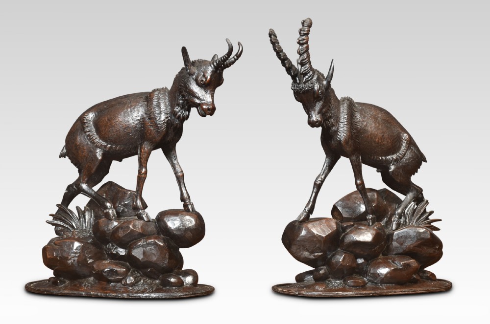 A nineteenth-century Black Forest carved wood mantel clock garniture set featuring sculpted alpine chamois figures atop rocky outcrops. View XIII