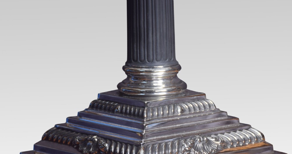 A Neoclassical style table lamp featuring a fluted Corinthian column base on a stepped pedestal, topped with a pleated beige fabric shade. View VII