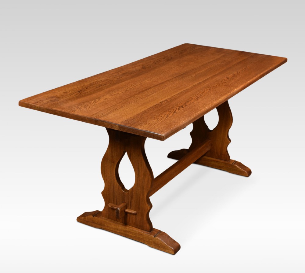 A rectangular oak refectory table featuring a thick plank top and trestle base joined by a central stretcher. View II