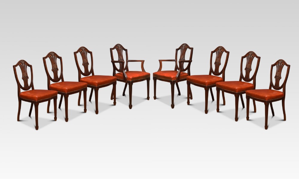 Eight Mahogany Shield Back Dining Chairs